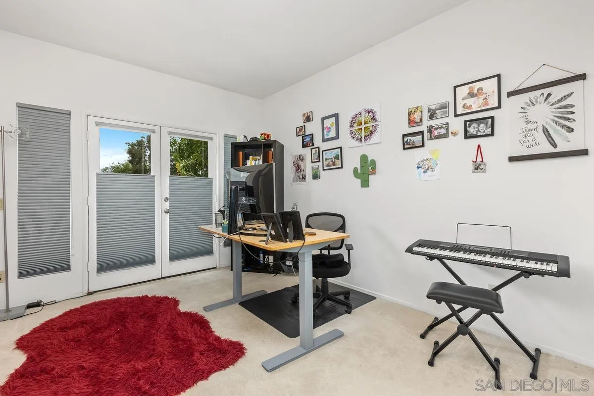13847 Carmel Ridge Road San Diego, CA 92128 - Photo 25 of 40 a living room with furniture and a window