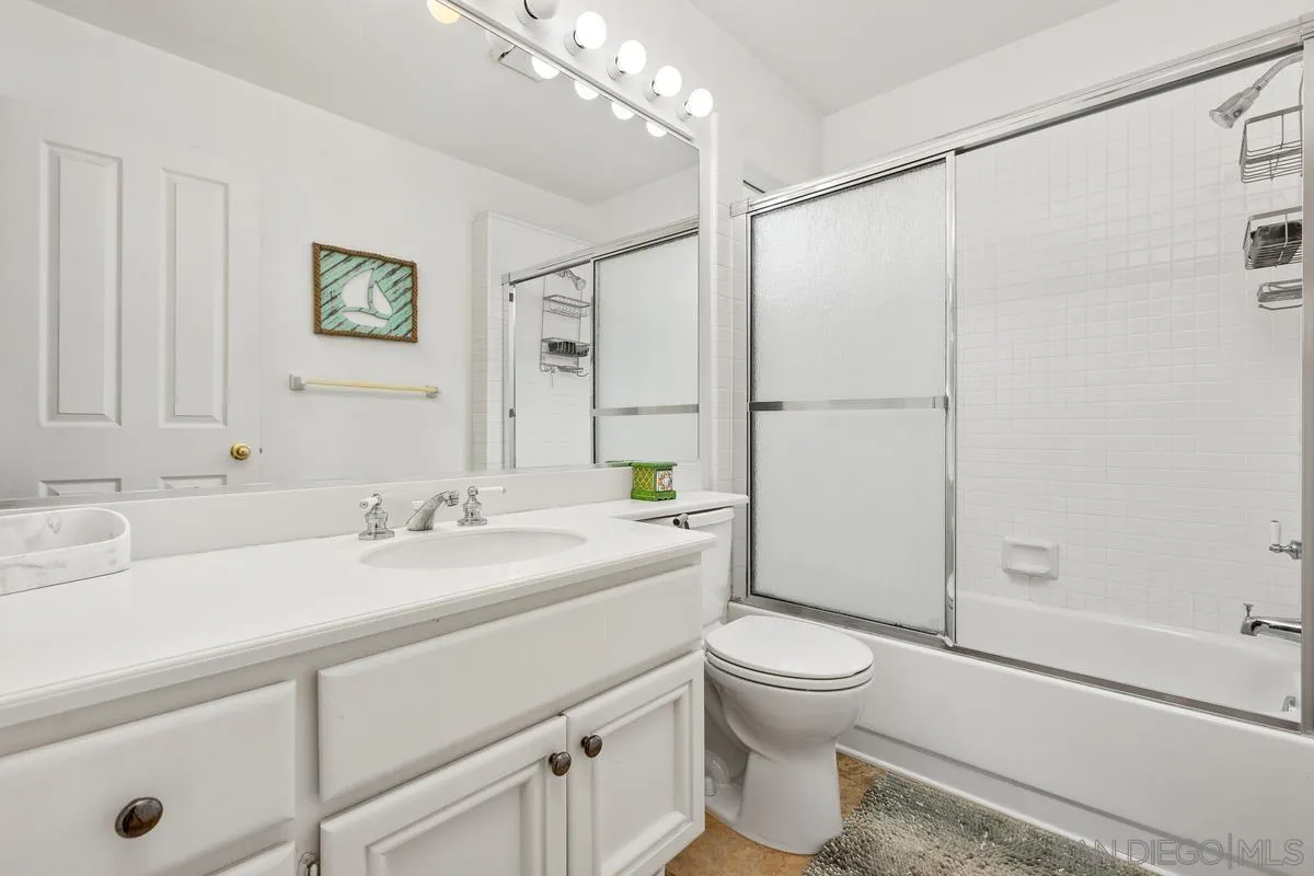 13847 Carmel Ridge Road San Diego, CA 92128 - Photo 26 of 40 a bathroom with a sink a toilet and shower