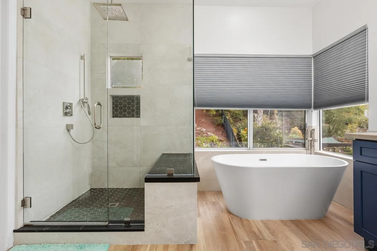 13847 Carmel Ridge Road San Diego, CA 92128 - Photo 29 of 40 a white bath tub sitting in a bathroom next to a window