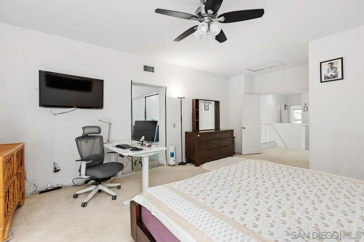 13847 Carmel Ridge Road San Diego, CA 92128 - Photo 32 of 40 a bedroom with a workspace