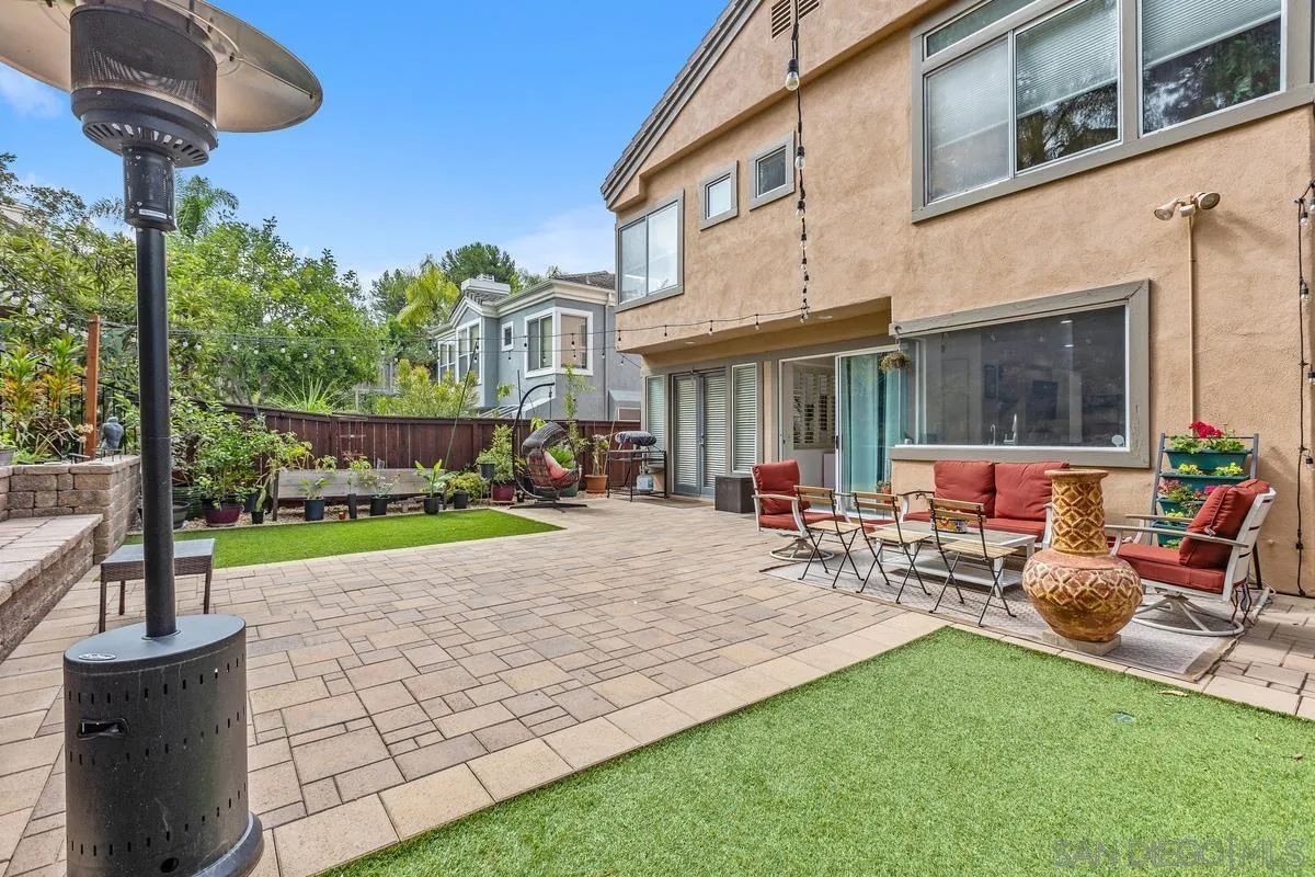 13847 Carmel Ridge Road San Diego, CA 92128 - Photo 34 of 40 a view of a patio with a table and chairs