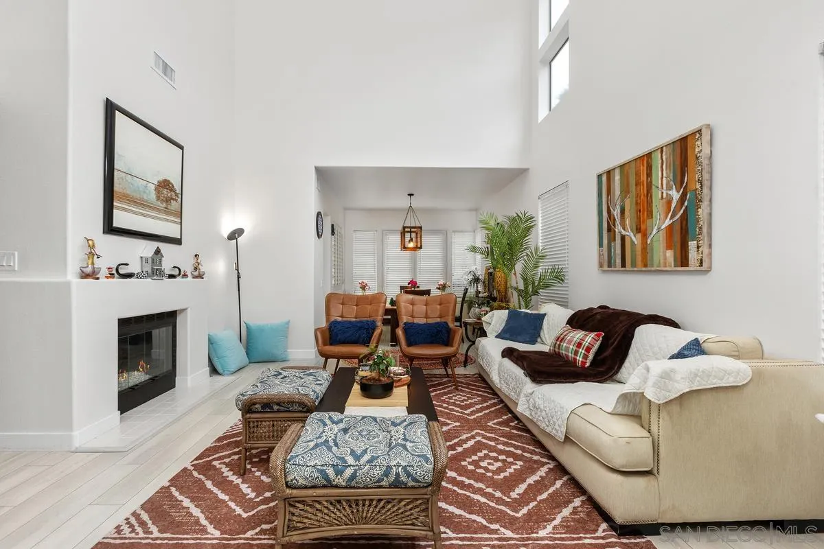 13847 Carmel Ridge Road San Diego, CA 92128 - Photo 4 of 40 a living room with furniture and a fireplace