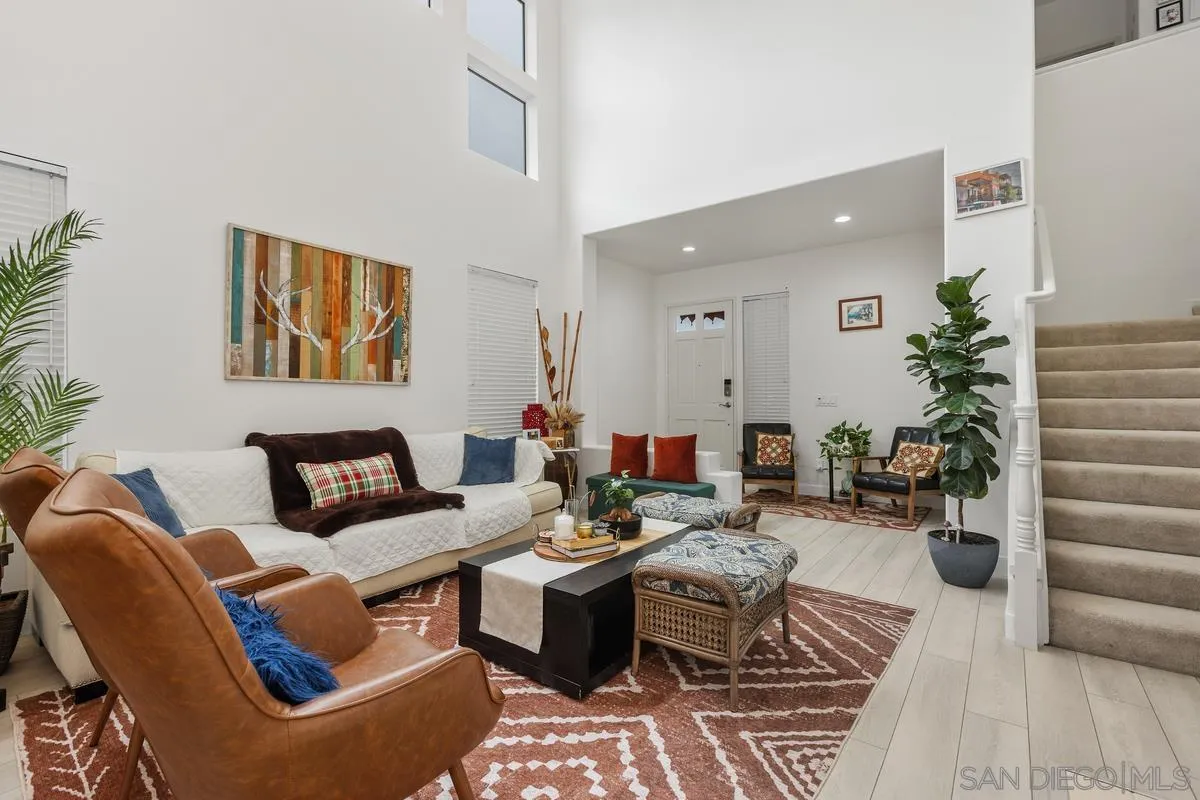 13847 Carmel Ridge Road San Diego, CA 92128 - Photo 5 of 40 a living room with furniture a rug and potted plant