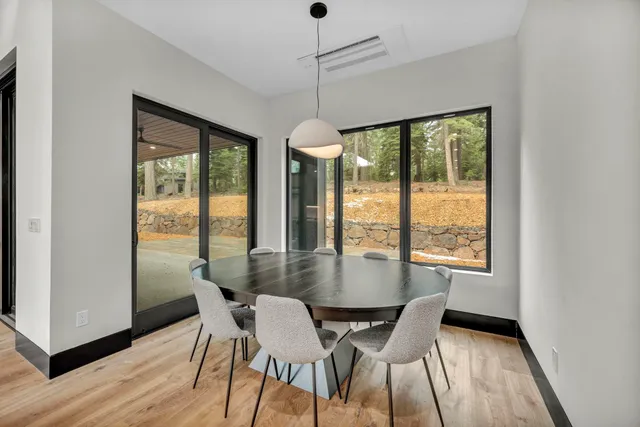 a dining room with furniture window wooden floor