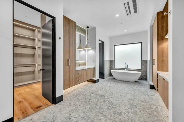 a view of an empty room and wooden floor