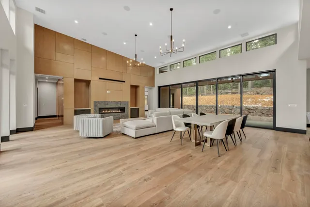 a view of a dining room with furniture window and wooden floor