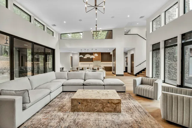 a living room with furniture ceiling fan and a rug