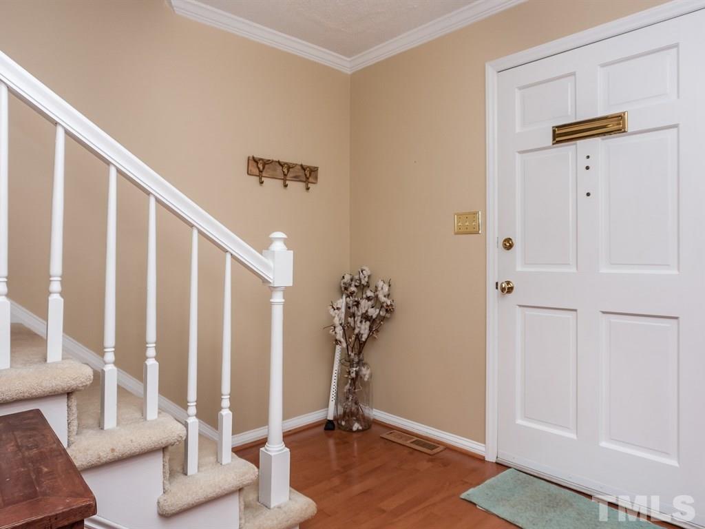 2866 Wycliff Road Raleigh, NC 27607 - Photo 3 of 25 a view of an entryway with wooden floor