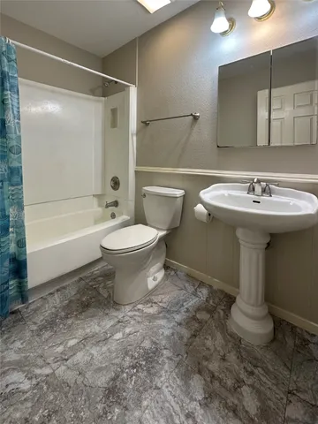 a backyard of a house with barbeque oven and trees