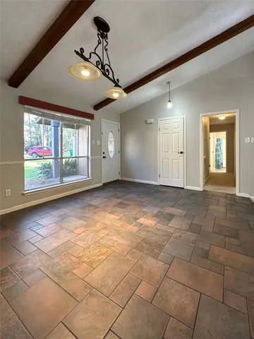 an aerial view of a house with swimming pool and mountain view