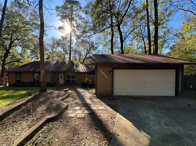 a kitchen with stainless steel appliances a stove a microwave and cabinets