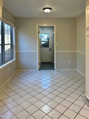 a bathroom with a shower and a mirror