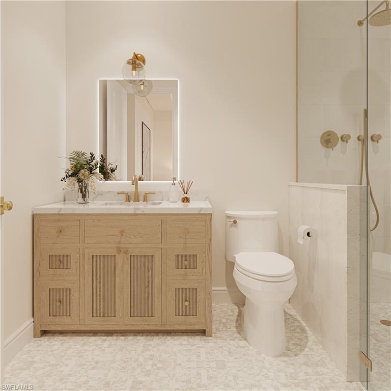 335 Burning Tree Drive Naples, FL 34105 - Photo 11 of 27 Bathroom with a tile shower and vanity