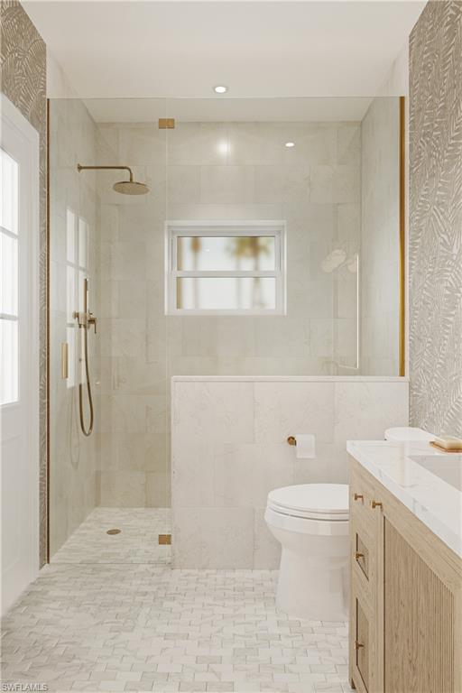 335 Burning Tree Drive Naples, FL 34105 - Photo 14 of 27 Bathroom featuring walk in shower, vanity, healthy amount of natural light, and wallpapered walls