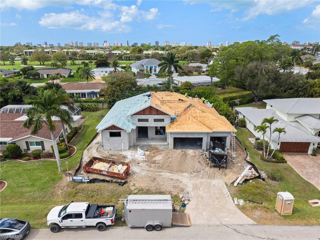 335 Burning Tree Drive Naples, FL 34105 - Photo 20 of 27 Drone / aerial view of city skyline