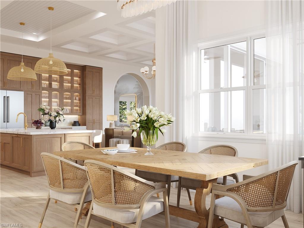 335 Burning Tree Drive Naples, FL 34105 - Photo 7 of 27 Dining space featuring coffered ceiling, arched walkways, light wood-type flooring, and suspended lighting