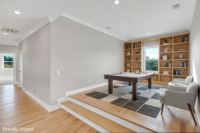 an aerial view of a house with a swimming pool