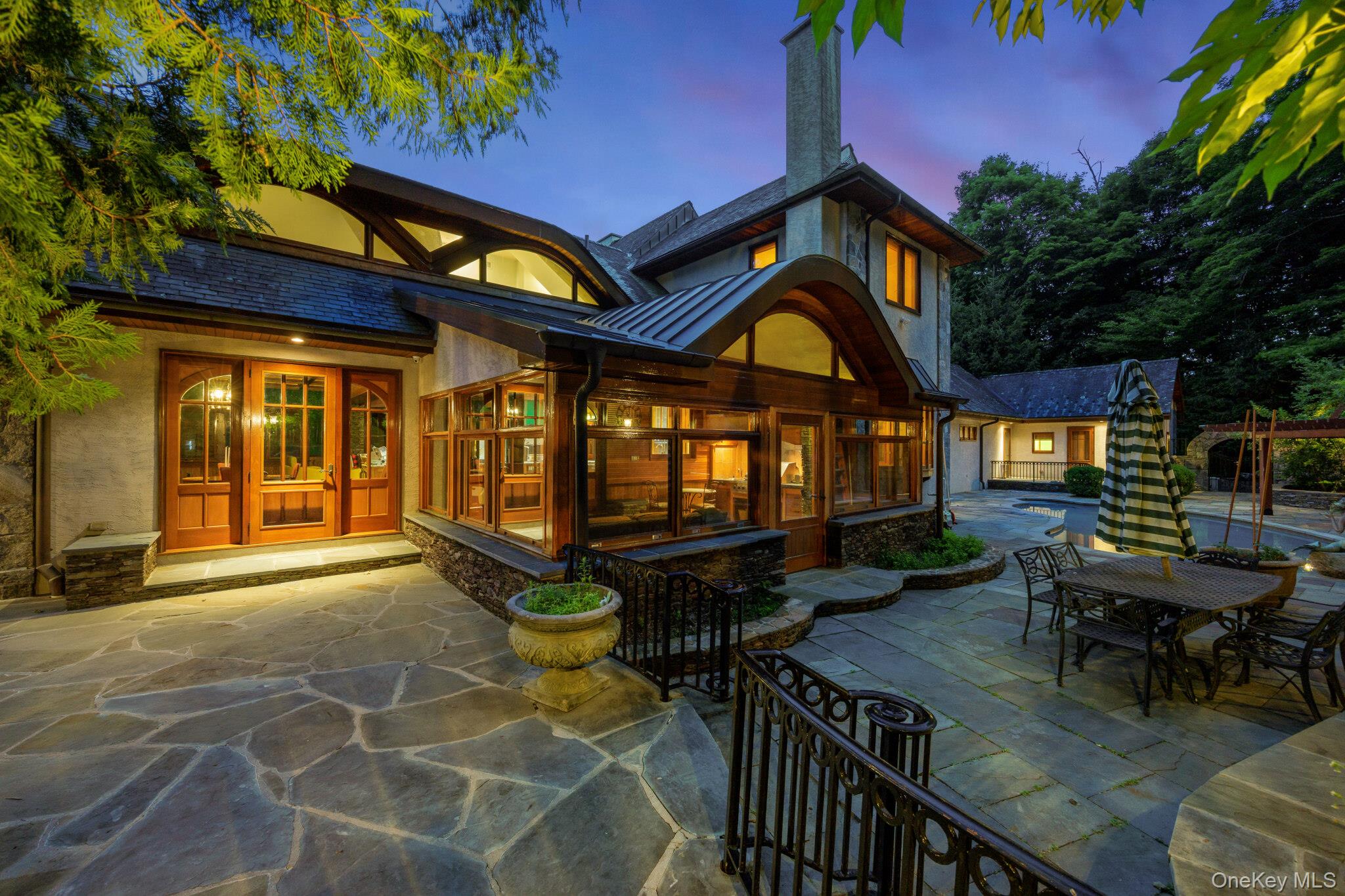 23 Inningwood Road Ossining, NY 10562 - Photo 6 of 50 Custom architectural design featuring a stone exterior, wood-framed windows, and curved roofing accents