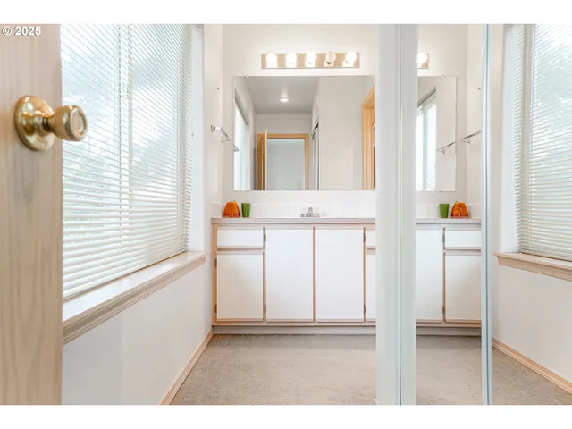 a bathroom with a shower and a sink