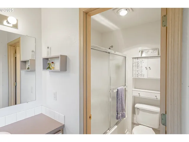 a bathroom with a sink vanity and a mirror