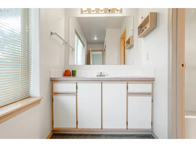 a kitchen with stainless steel appliances a refrigerator sink and cabinets