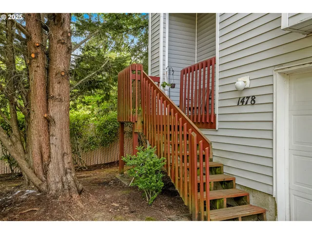 a view of entryway with stairs and wooden floor