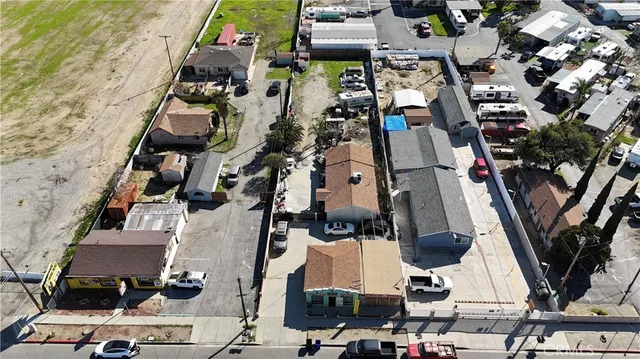 an aerial view of residential houses with outdoor space