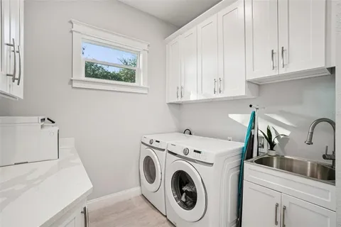 a bedroom with a bed a flat screen tv and a fireplace
