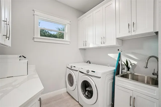 a bedroom with a bed a flat screen tv and a fireplace