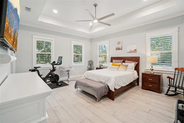 a living room with a fireplace and a flat screen tv