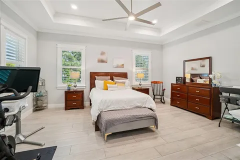 a spacious bedroom with two beds and a large window