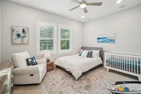 a bathroom with a sink toilet a mirror and shower
