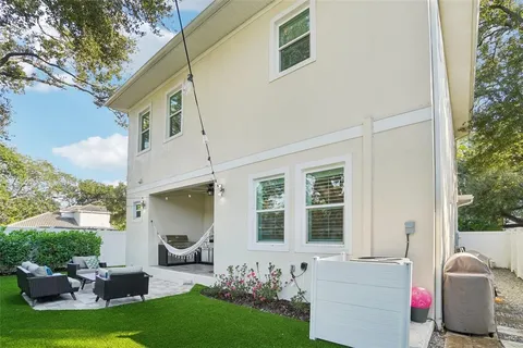 a view of a couches in backyard of house