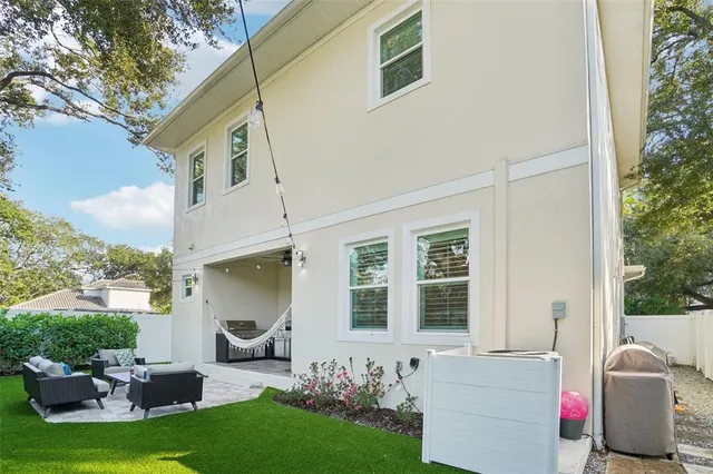 a view of a couches in backyard of house