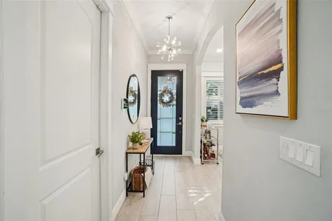 a view of an entryway with wooden floor