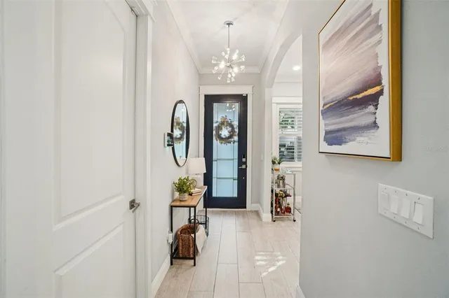 a view of an entryway with wooden floor