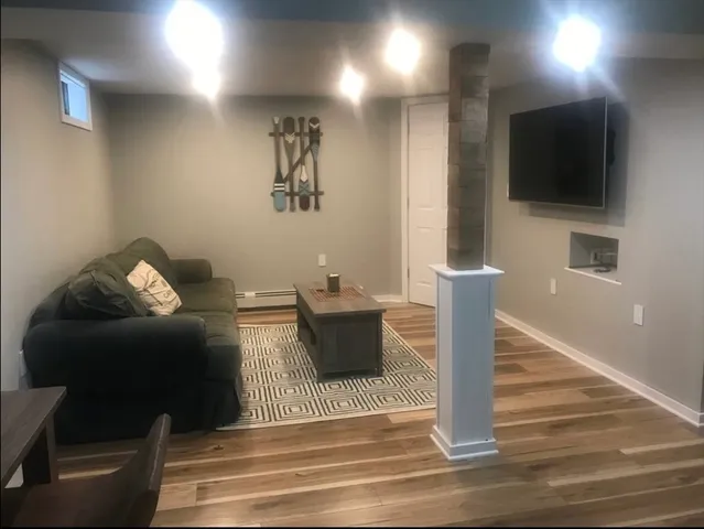a living room with furniture and a flat screen tv