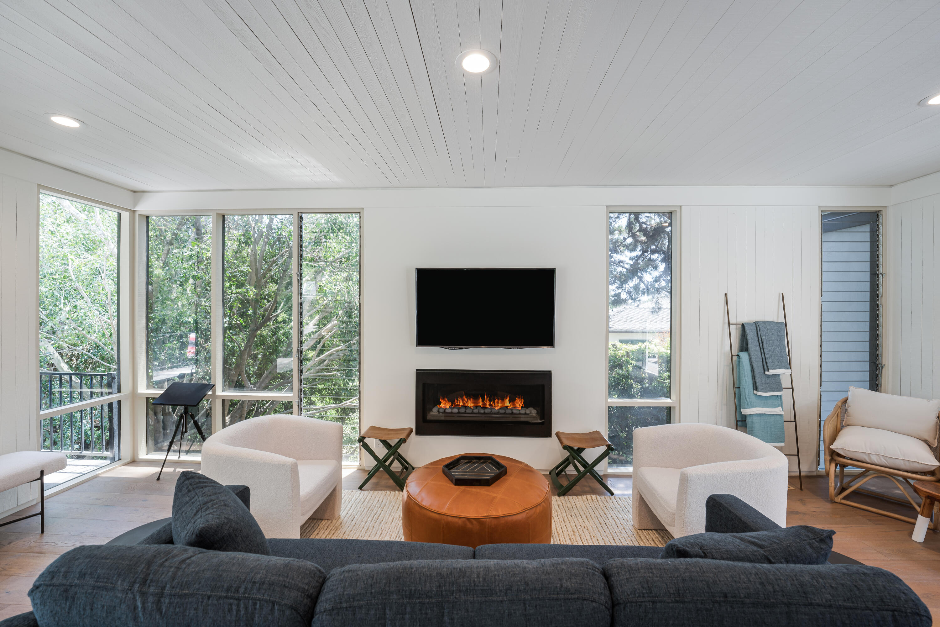180 Hermosillo Road Montecito, CA 93108 - Photo 2 of 31 a living room with furniture a flat screen tv and a fireplace