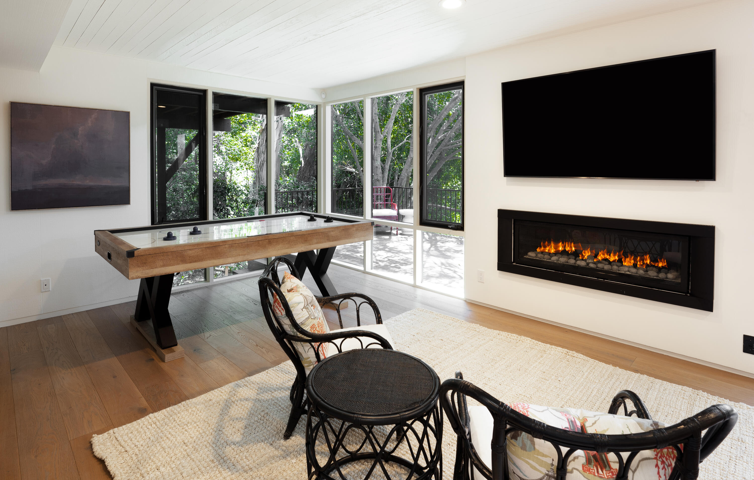 180 Hermosillo Road Montecito, CA 93108 - Photo 24 of 31 a living room with furniture a flat screen tv and a fireplace