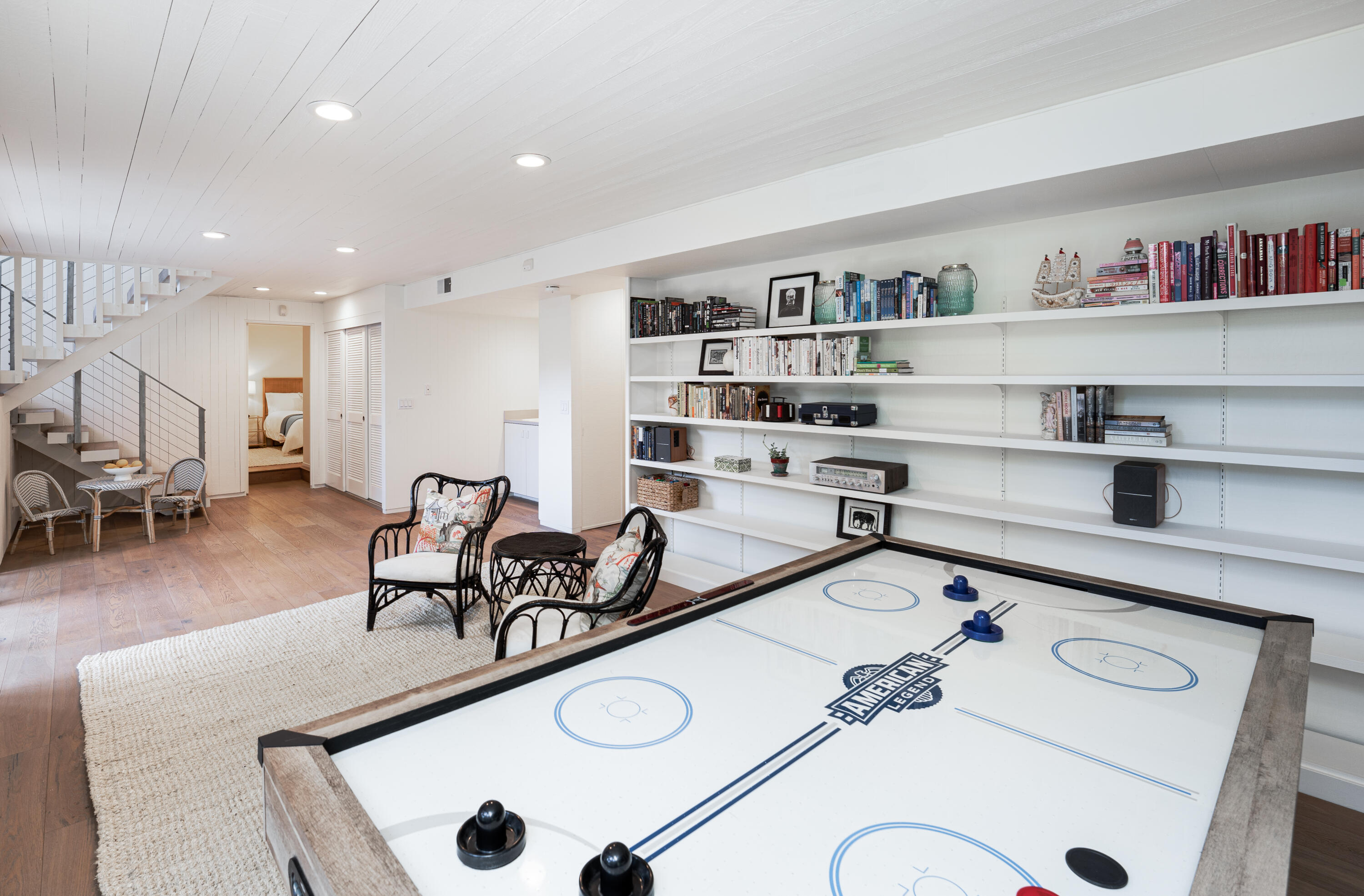 180 Hermosillo Road Montecito, CA 93108 - Photo 25 of 31 a living room with furniture and a book shelf