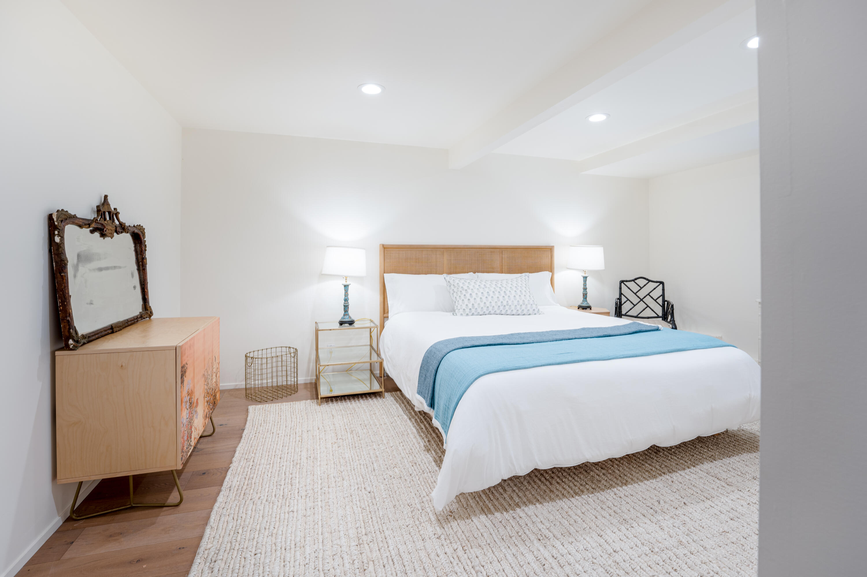 180 Hermosillo Road Montecito, CA 93108 - Photo 28 of 31 a bedroom with a bed and wooden floor