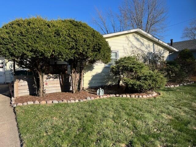 6833 Tyler Street Merrillville, IN 46410 - Photo 2 of 3 a view of a backyard with large trees