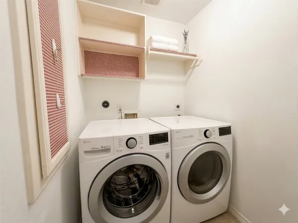 a utility room with dryer and washer
