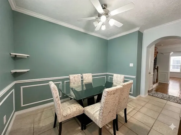 a balcony with a table and chairs