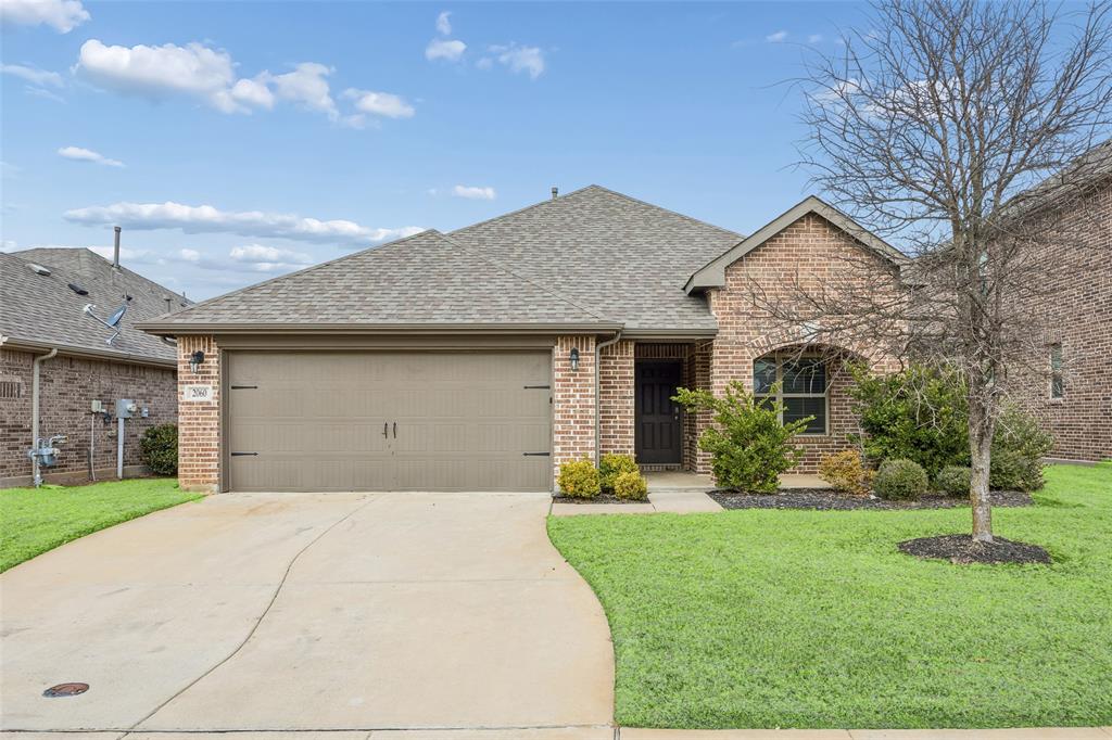 2060 Glaston Road Forney, TX 75126 - Photo 1 of 1 a front view of a house with a yard and garage