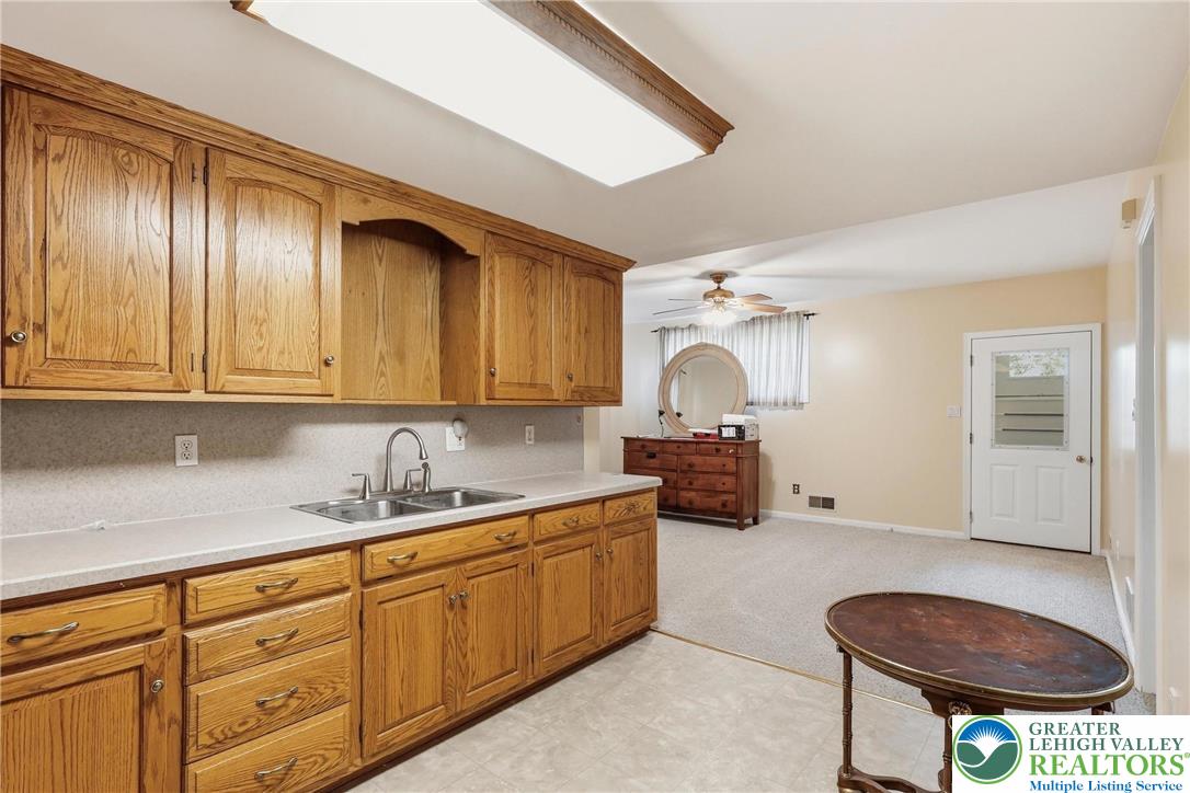 5217 Cider Press Road Schnecksville, PA 18078 - Photo 40 of 54 a kitchen with a sink cabinets and window