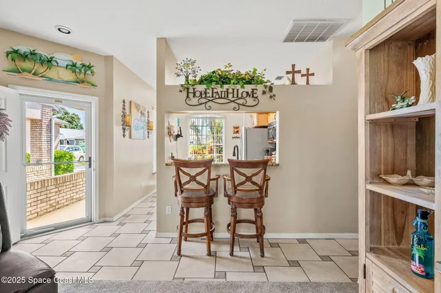 a view of a dining room with furniture window and outside view