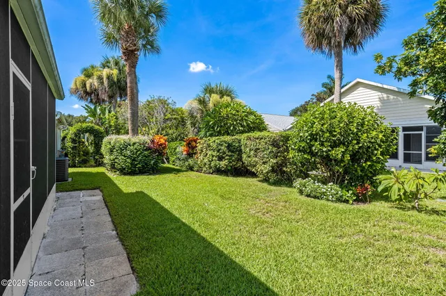 a view of a garden with a house