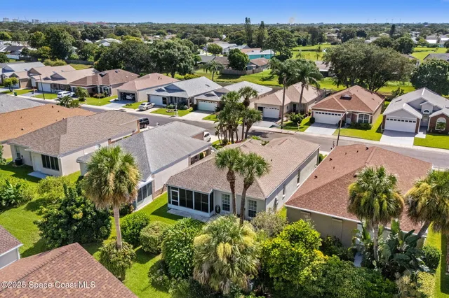 an aerial view of a house with a garden