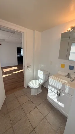 a bathroom with a sink a toilet and a bathtub